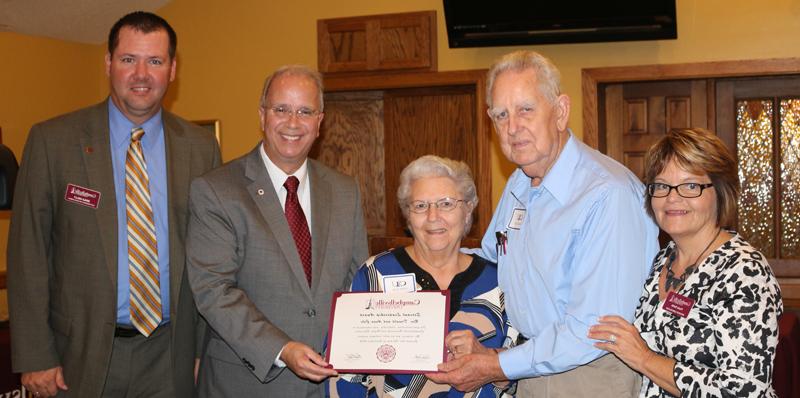 The Rev. Don and Anna Cole of Owensboro received a Servant Leadership Award for their work with Campbellsville University. From left are: Paula Smith, director of alumni relations; Cole, Mrs. Cole, Dr. Michael V. Carter, president; and Benji Kelly, vice president for development. (Campbellsville University Photo by Drew Tucker)