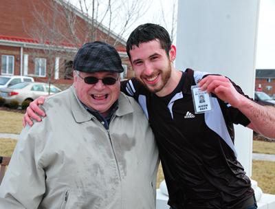 Harry Haynes, left, gives his professor Stan McKinney a hug after coming out of the fountain at Alumni &  Friends Park. McKinney is the founder of the Tiger  Plunge and is in second place in pledges -- behind  Haynes. Other who plan to plunge are: Dr. Michael V.  Carter, Dr. Bob Wade, Dr. John Hurtgen, Dr. Jason Garrett, Dr. Tony Cunha, Rob Roberts, Jordan Antle, Jayson Barnes, Aris Kuntz, Cameron Jackson, Ye Wei "Vicky," Shelby Mattingly, Joshua Vincent, Luisa  Martini and Christopher Mills. 