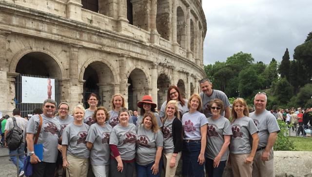 Educators and students from Campbellsville University's School of  Education on a trip to  Italy pose at the Coliseum in Rome, Italy.