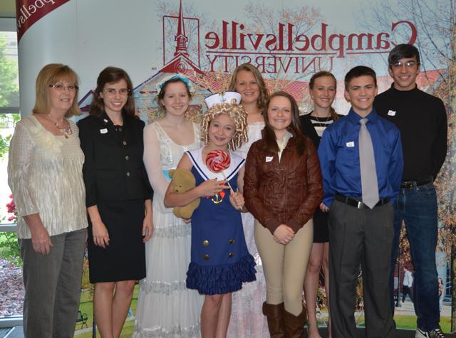 Campbellsville University Middle School Leadership met at Campbellsville University for their annual banquet May 10. Students from Taylor County Middle School Leadership dressed as their favorite person for the banquet. Students from left include: front -- Anthony Hillard (Joe Paterno), Korri Briggs (Amelia Earhart) and Sydney Humphress (Shirley Temple Black). Back row -- Justice Gregory (Steve Jobs), Allison Brockman (Martha Layne Collins), Reagan Pollock (Loretta Lynn), Jilly Bruns (Jane Austen), Payton Howard (Sarah Palin) and Patricia Jones, social studies teacher who is adviser for the group. Campbellsville University’s College of Arts and Sciences works with the schools and their leadership program. (Campbellsville University Photo by Joan C. McKinney)